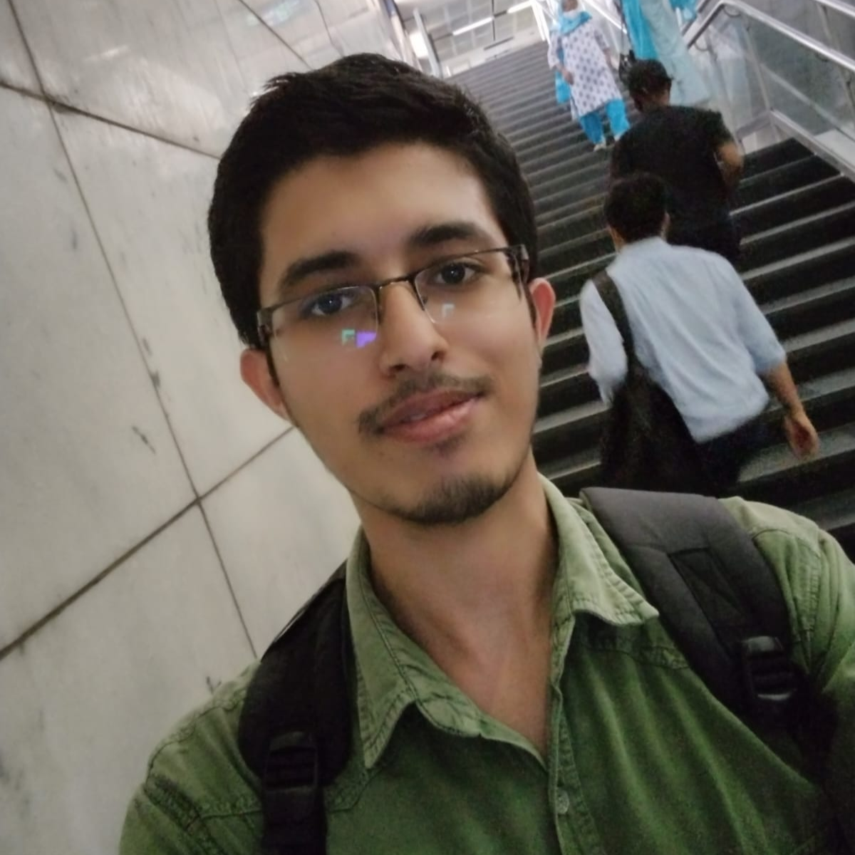 A designer and coder from India, in metro station